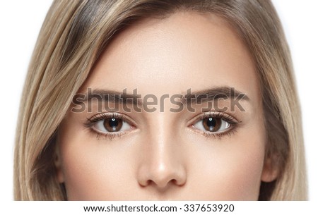 Eyes Beautiful woman face portrait close up studio on white blonde