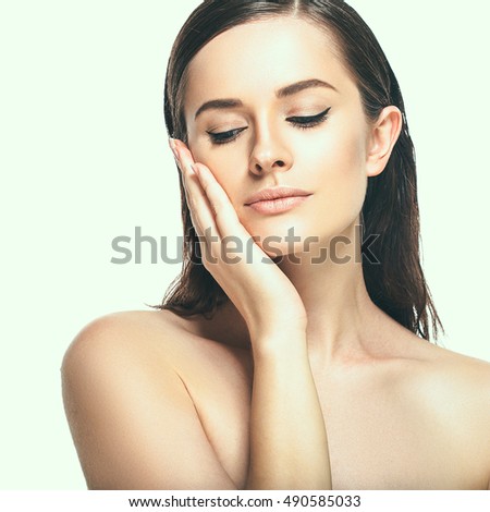 Beautiful woman face close up studio on white
