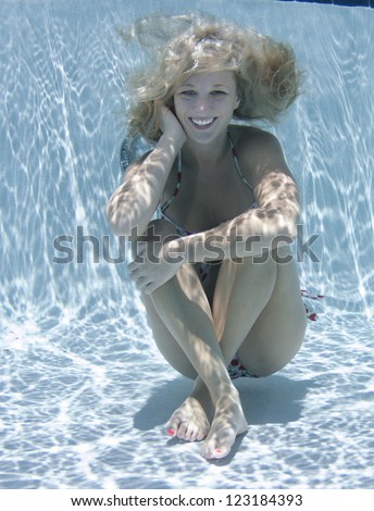 stock photo smiling blonde haired model underwater 123184393