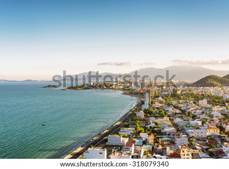 Beautiful view on Nha Trang and Nha Trang Bay of the South China Sea on blue sky background in Khanh Hoa province at afternoon in Vietnam. Nha Trang is a popular tourist destination of Asia.