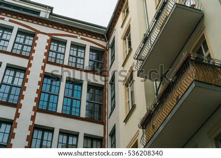 Apartment Exterior Stock Images, Royalty-Free Images & Vectors ... industrial building next to old apartment block with balconies