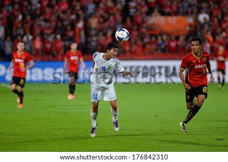 NONTHABURI-FEB 8,Nguyen Hong Tien(W) of Hanoi T&T Jump tackles football during AFC Champions League 2014 between SCG Muangthong utd and Hanoi T&T at SCG Stadium on February8,2014 in Thailand