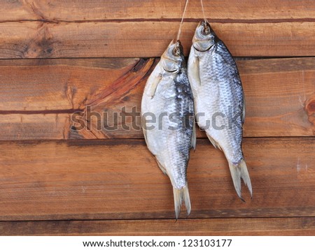 Dry fish on a wooden background