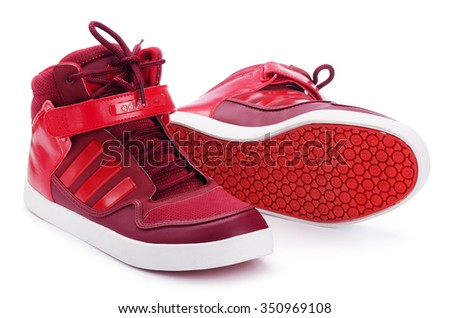 SAMARA, RUSSIA - August 17, 2015: Adidas sneakers for running, training, in red, showing the Adidas logo and famous three stripes, illustrative editorial