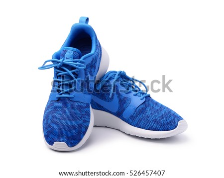 SAMARA, RUSSIA - June 8, 2015: female Nike sneakers for running, training, in gray and blue, showing the Nike logo, illustrative editorial