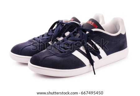 SAMARA, RUSSIA - June 20, 2017: Blue Adidas sneakers for running, football, training, in gray and blue, showing the red Adidas logo and famous three stripes, illustrative editorial