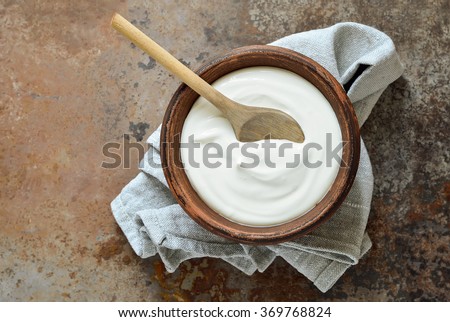 Homemade yogurt or sour cream in a rustic bowl