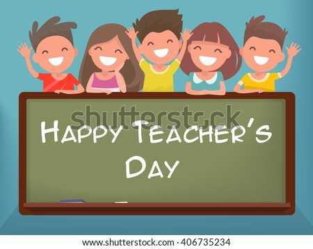 Little schoolchildren at the blackboard. Happy Teacher's Day