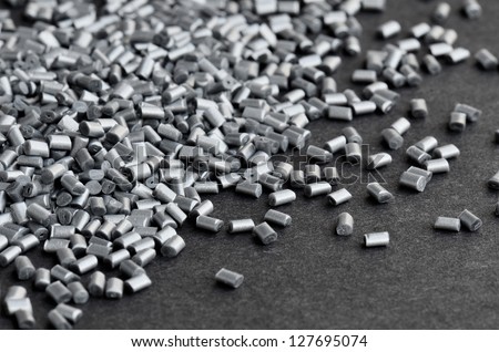 silver metallic polymer resin on grey background