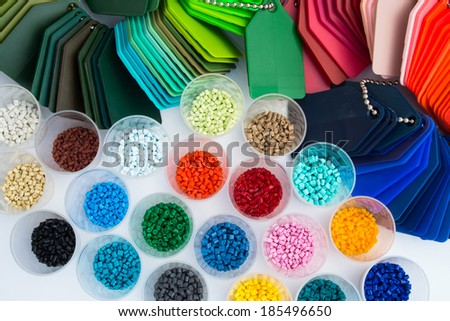several dyed plastic polymer granulates in laboratory