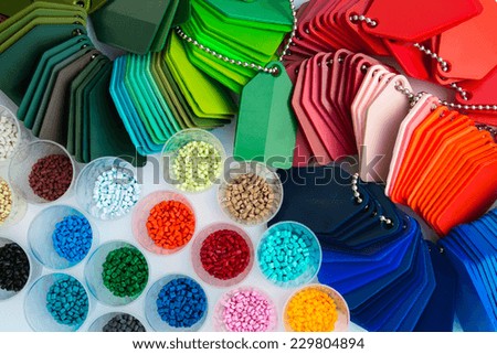 several dyed plastic polymer granulates in laboratory