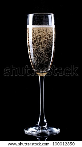 glass of champagne on black background
