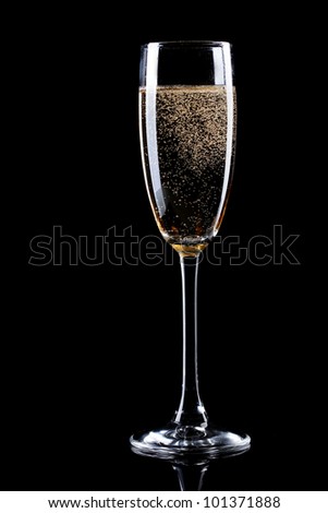 glass of champagne on black background