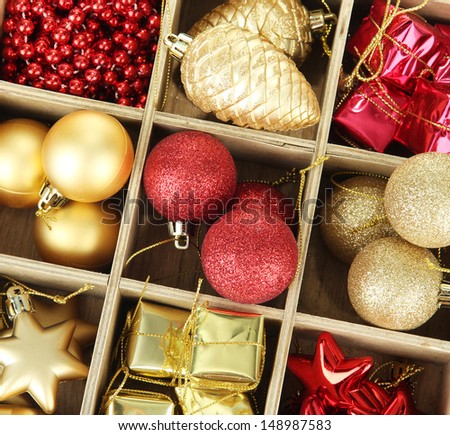 Wooden box filled with christmas decorations, isolated on white
