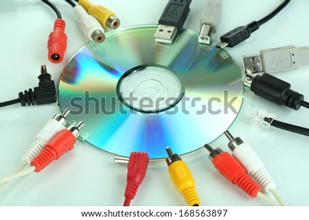 Disk and various connector cables isolated on white