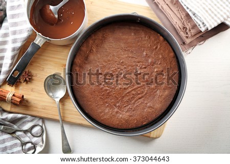 Tasty Chocolate Cake In Baking Pan On A Table Tasty Chocolate Cake In Baking Pan On A Table