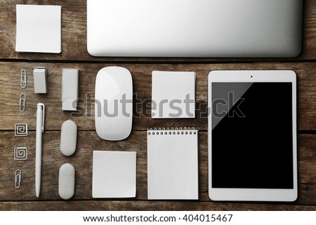 Set of office stationery with a computer on a wooden background