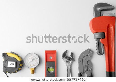 Plumber equipment on light background