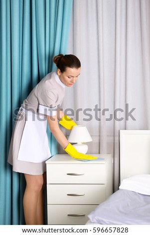 Best Way To Dust Furniture Concept hotel service concept chambermaid cleaning lamp stock photo Best Way To Dust Furniture Concept hotel service concept chambermaid cleaning lamp stock photo