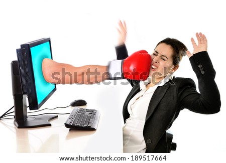 stock-photo-business-woman-sitting-on-desk-with-with-computer-hit-by-boxing-glove-coming-out-of-monitor-in-189517664.jpg