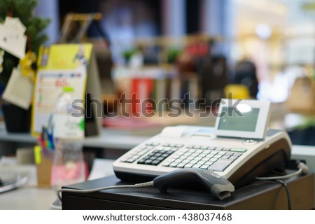 One cash register with a bar code reader.