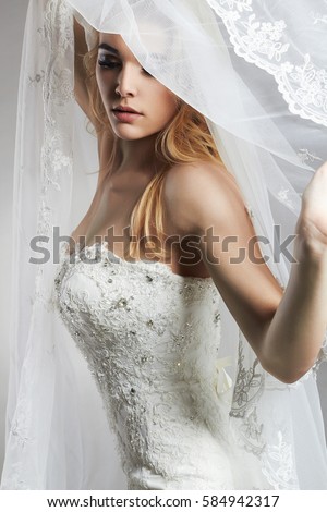 https://thumb1.shutterstock.com/display_pic_with_logo/1411597/584942317/stock-photo-beautiful-bride-woman-in-wedding-dress-and-veil-fashion-portrait-of-young-gorgeous-bride-wedding-584942317.jpg