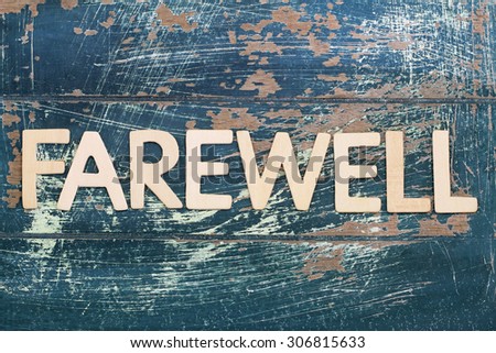 Word Farewell Written On Rustic Wooden Surface Word Farewell Written On Rustic Wooden Surface