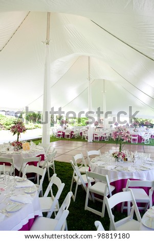 Inside A Large Wedding Tent Set Up For An Outdoor Reception Inside A Large Wedding Tent Set Up For An Outdoor Reception