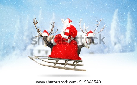 Santa Claus with reindeer and gifts on the country