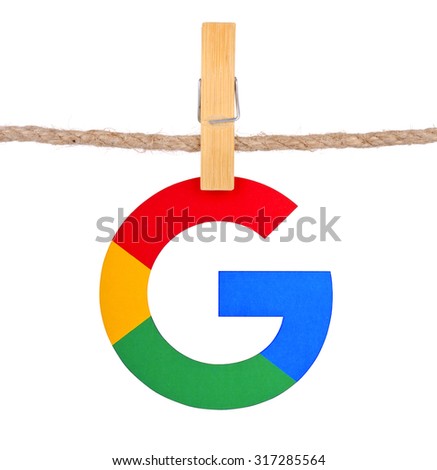 KIEV, UKRAINE - SEPTEMBER 16, 2015: Logo largest Internet search engine Google hanging on the clothesline isolated on white background.Google it is the largest Internet search engine, owned of Google