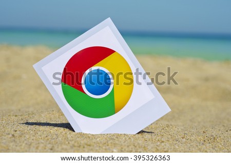 Kiev, Ukraine - August10, 2015: Google Chrome ogotype printed on paper and placed in the sand against the sea. Google Chrome is a freeware web browser.