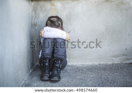 A six years old school girl to the schoolyards