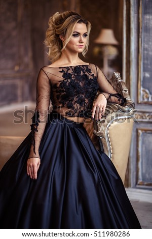 https://thumb1.shutterstock.com/display_pic_with_logo/1532018/511980286/stock-photo-beautiful-young-woman-in-gorgeous-black-evening-dress-with-perfect-makeup-and-hair-style-511980286.jpg