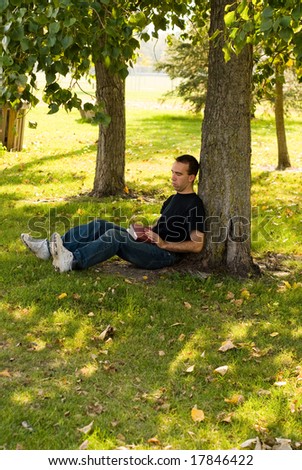 Man Sitting Under Tree Stock Images, Royalty-Free Images & Vectors ...