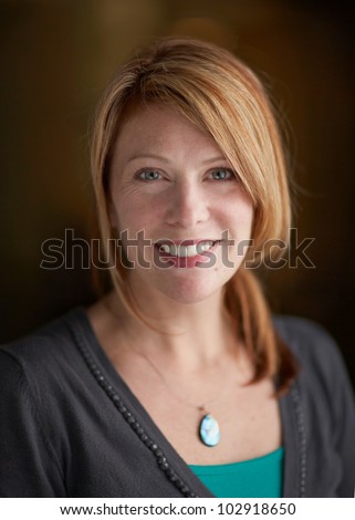 https://thumb1.shutterstock.com/display_pic_with_logo/156268/102918650/stock-photo-attractive-woman-with-red-hair-smiling-happy-headshot-focus-on-face-102918650.jpg