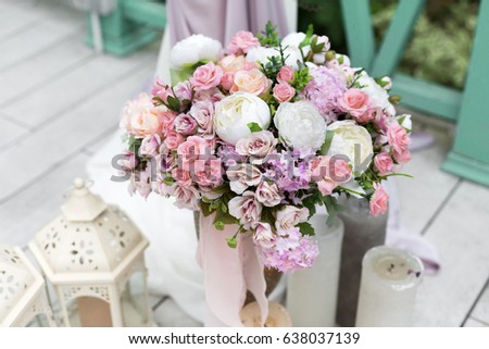 Wedding Reception Flower Decorations Rustic Style Bridal Bouquet And Candles On Wooden Vintage Background Wedding Reception Flower Decorations Rustic Style Bridal Bouquet And Candles On Wooden Vintage Background