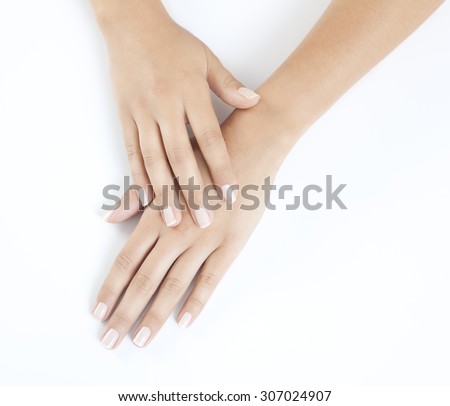 woman hands with beautiful fingernails against a white background