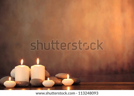 Zen stones and aromatic candles on table,Zen concept.