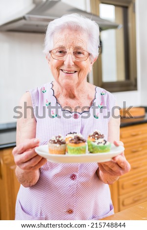 Woman Decorating Cupcakes colorful cupcakes frosted variety frosting flavors stock photo Woman Decorating Cupcakes colorful cupcakes frosted variety frosting flavors stock photo