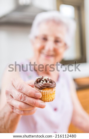 Woman Decorating Cupcakes old woman making decorating cupcakes stock photo 215748847 Woman Decorating Cupcakes old woman making decorating cupcakes stock photo 215748847