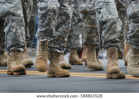 Soldiers dressed in army camouflage in an army parade