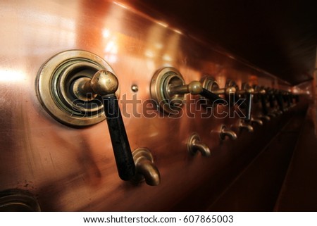 Amsterdam, Netherlands, April 12, 2016 : Beer Tap in the Heineken Experience where is a historic brewery and corporate visitor center for the internationally distributed Dutch pilsner, Heineken beer.