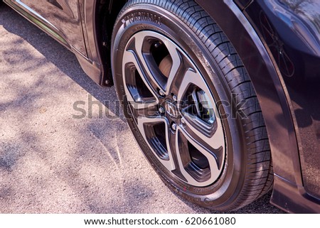Bangkok, Thailand - April 13, 2017: Car wheel close up Honda HRV Black Steering Wheel And Silver Logo. Honda Motor Co., Ltd. is a Japanese public multinational conglomerate corporation.