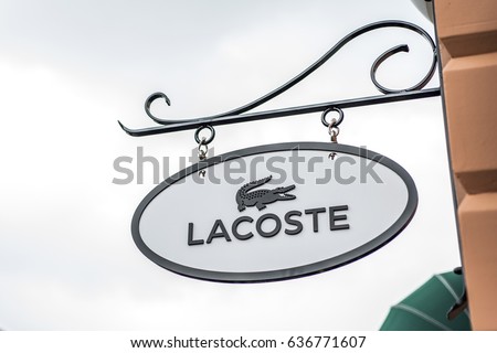 Roermond, Netherlands 07.05.2017 Logo of Lacoste Store in the Mc Arthur Glen Designer Outlet shopping area