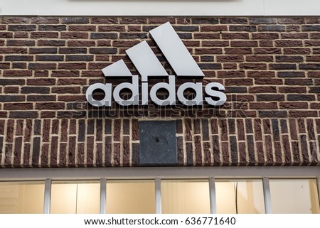 Roermond Netherlands 07.05.2017 Logo of the adidas brick house Store in the Mc Arthur Glen Designer Outlet shopping area
