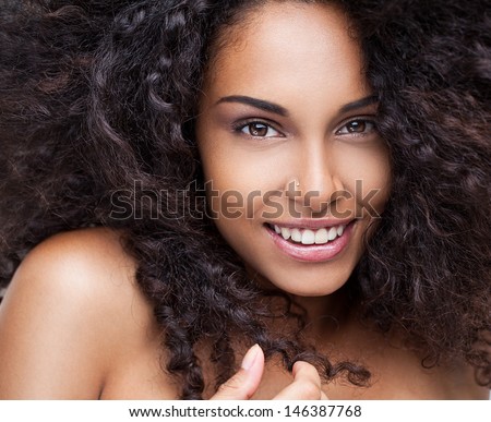 Portrait of a beautiful young African woman smiling.