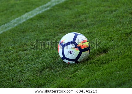 LONDON, ENGLAND - JULY 26, 2017: New Nike Ordem 5 ball. Close-up of 2017/18 season Official Premier League Ball on the green football pitch.