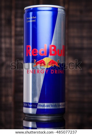 LONDON, UNITED KINGDOM-SEPTEMBER 15, 2016: Can of Red Bull Energy Drink. In terms of market share, Red Bull is the most popular energy drink in the world.On blue background.