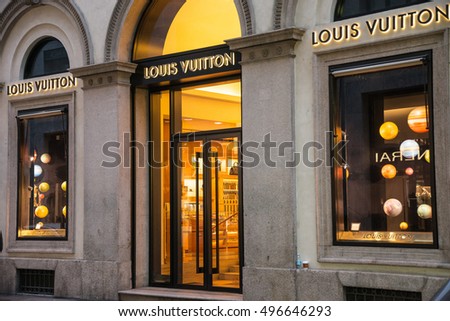 Milan, Italy - October 8, 2016: Shop window and entrance of a Louis Vuitton shop in Milan - Montenapoleone street, Italy. Few days after Milan Fashion Week. Fall Winter 2017 Collection.