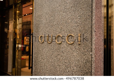 Milan, Italy - October 9, 2016: Shop window and entrance of a Gucci shop in Milan - Montenapoleone street, Italy. Few days after Milan Fashion Week. Fall Winter 2017 Collection.